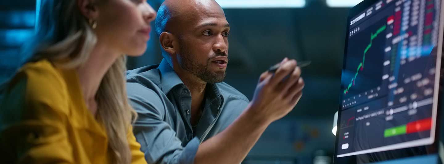 People talking about data on a screen