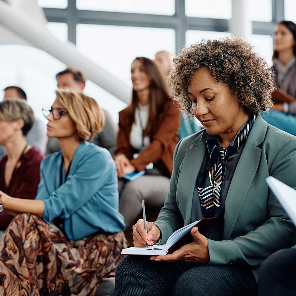 Woman writing in class