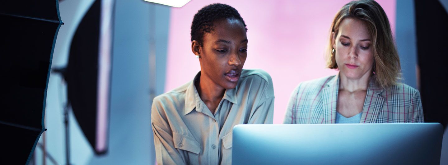 Two women looking at computer