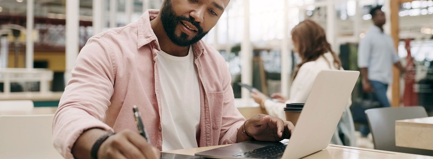 Man writing at computer