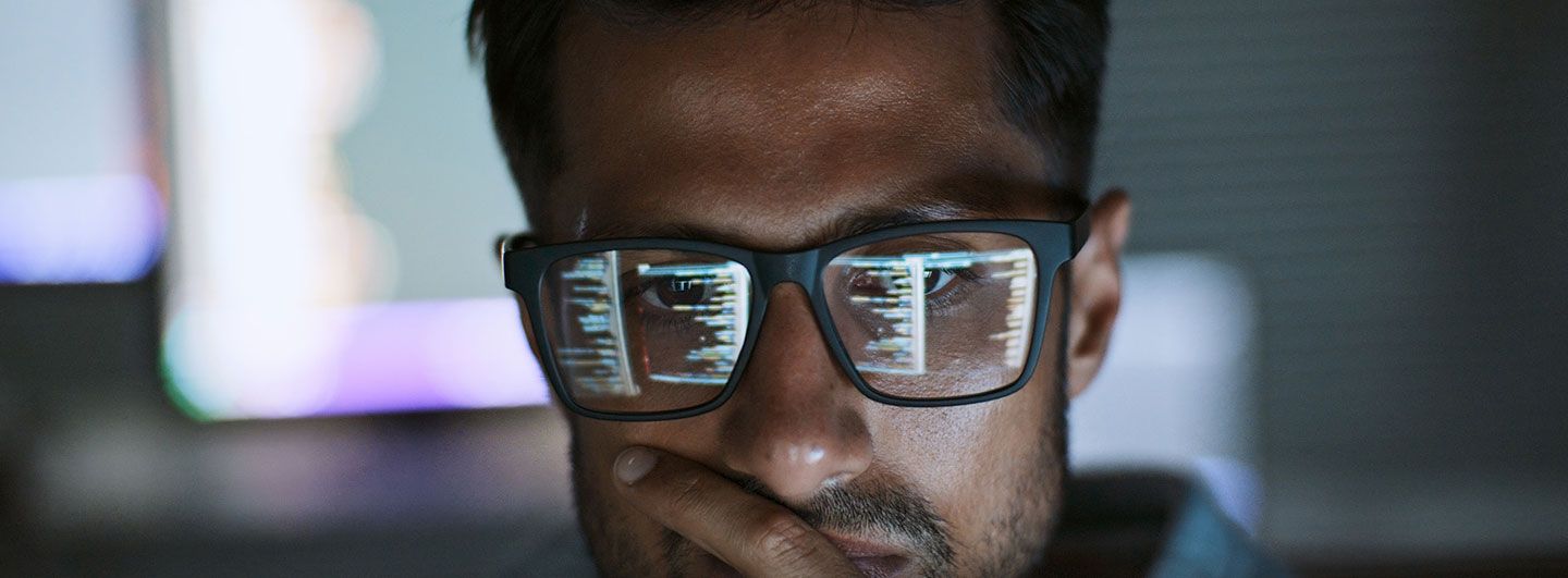 Man looking at data on screen