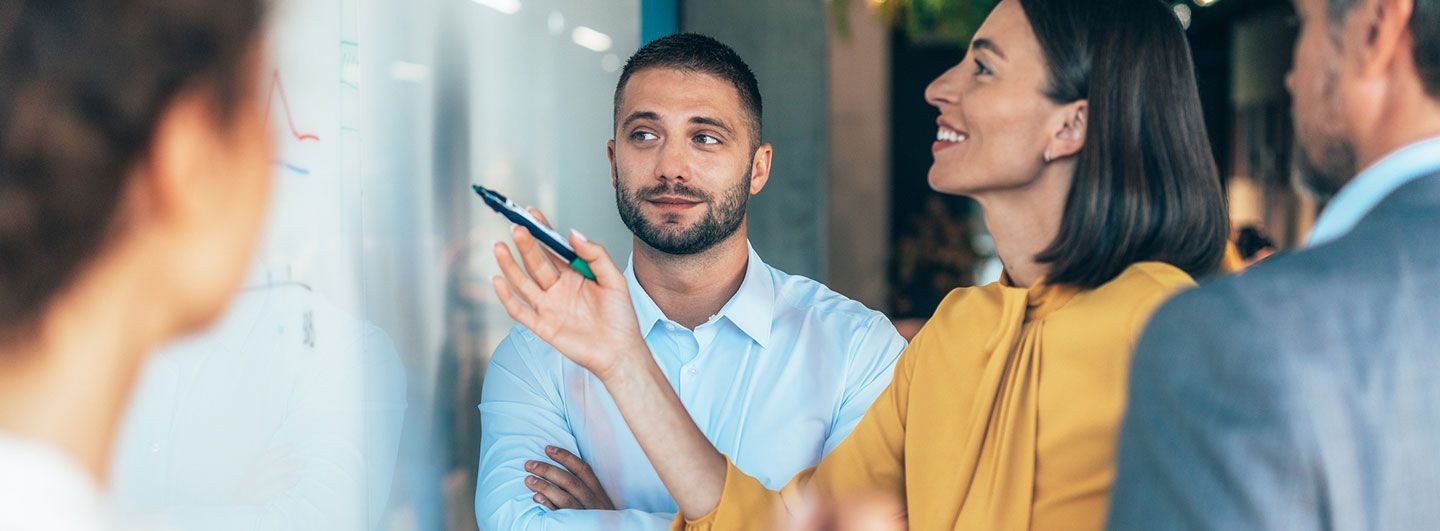 People planning on whiteboard