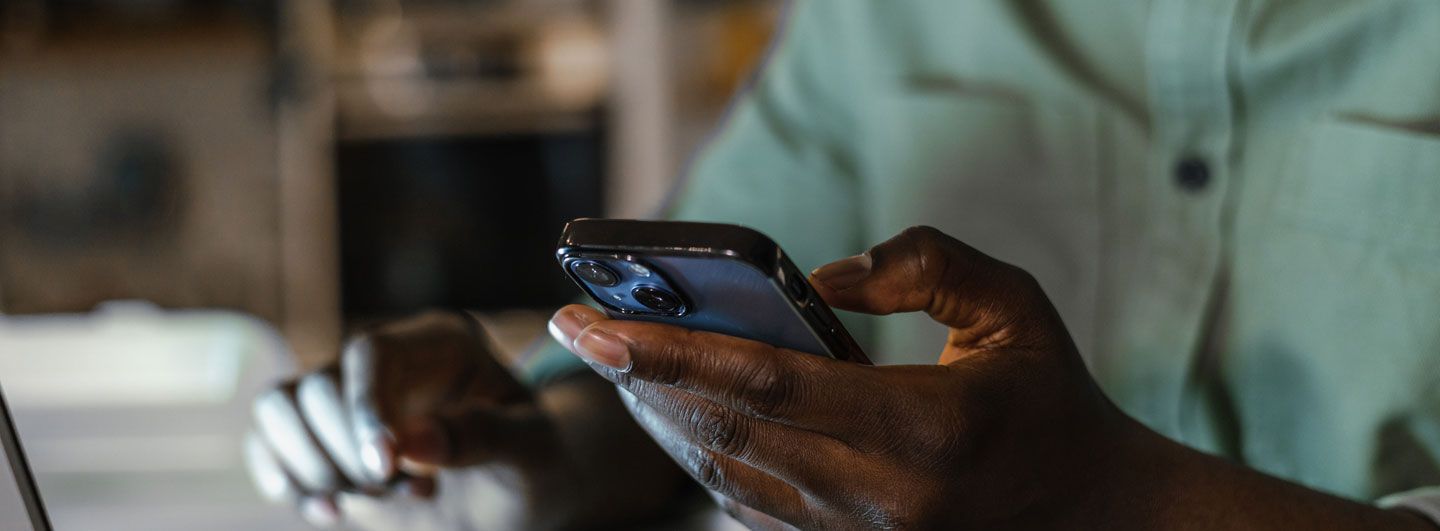 Hand on mobile phone