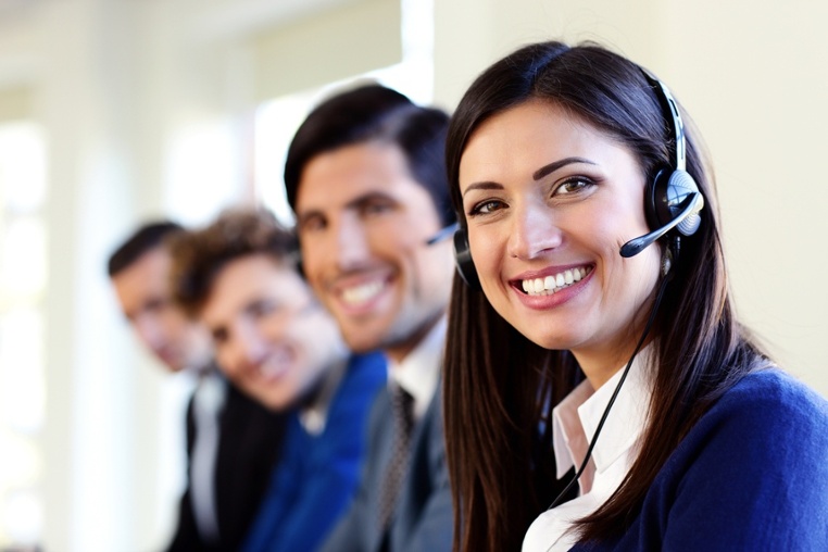 Cheerful young businesspeople and colleagues in a call center office-1.jpeg